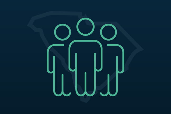three people standing icon with outline of South Carolina behind it