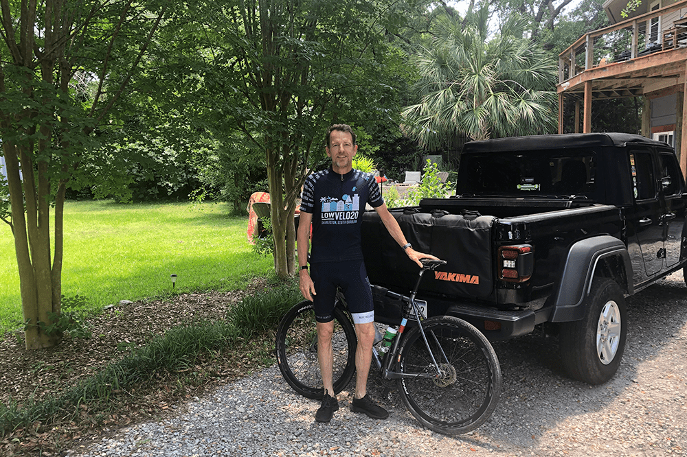 Robert Conley standing with his bike